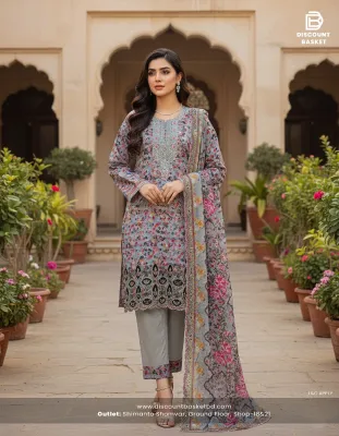 Elegant Pakistani-inspired Swiss Lawn suit with intricate boring work.